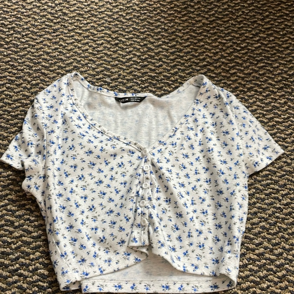 white crop top with blue flowers